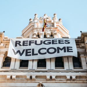 Picture of a façade with banner Refugees welcome